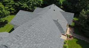 residential roof with asphalt shingles surrounded by green trees free photo residential roof with asphalt shingles surrounded by green trees free photo